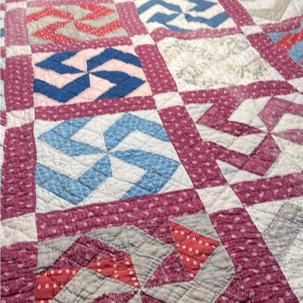 Patchwork Quilt with Pink and Blue Accents
